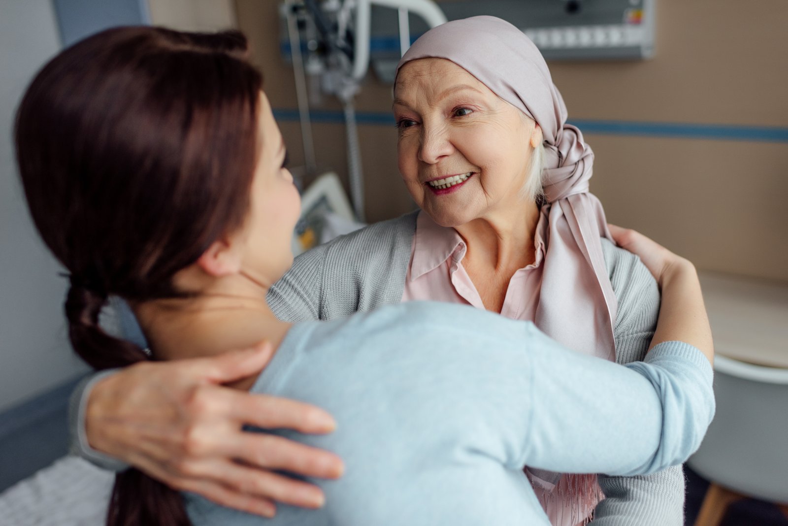 Person receiving a caring embrace during treatment